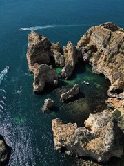 This aerial photo captures the stunning rock formations and turquoise waters at Ponta da Piedade in Lagos, Algarve. 
