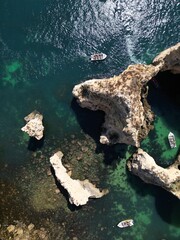 This aerial photo captures the stunning rock formations and turquoise waters at Ponta da Piedade in Lagos, Algarve. 