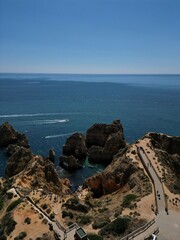 This aerial photo captures the stunning rock formations and turquoise waters at Ponta da Piedade in Lagos, Algarve. 