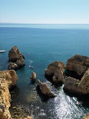 This aerial photo captures the stunning rock formations and turquoise waters at Ponta da Piedade in Lagos, Algarve. 