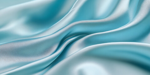 Fototapeta premium A light powder-blue surface with a smooth, satin-like texture. The cool, soft color and luxurious texture create a refined and elegant background.