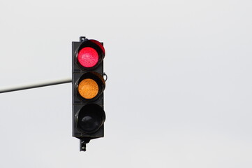 Stop red and orange light on traffic lights. Isolated on white background. Negative copy space for...