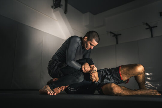 brazilian jiu jitsu bjj no gi grappling training two athletes practice - Powered by Adobe