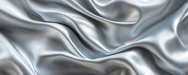 Fototapeta premium A sophisticated abstract background featuring silky, 3D wave patterns in shades of silver and white. The fabricâ€™s smooth, flowing texture adds a modern, elegant touch.
