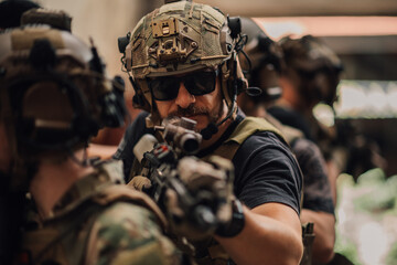 Portrait of soldier in crowd on a mission holding rifle at battlefield