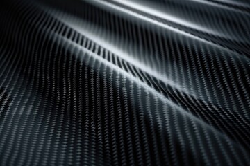 Dark Abstract Pattern of a Wavy Black Carbon Fiber Surface