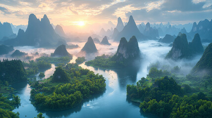 A breathtaking sunrise over a river winding through a misty valley of karst mountains.