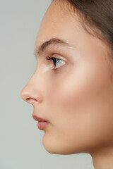 Close Up Profile Portrait of Young Woman With Soft Makeup
