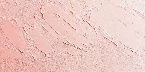 Fototapeta premium A light coral surface with a fine, stippled texture. The soft, warm hue combined with the delicate texture creates an inviting and visually pleasing background.