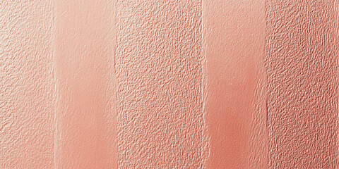 Fototapeta premium A light coral surface with a fine, stippled texture. The soft, warm hue combined with the delicate texture creates an inviting and visually pleasing background.
