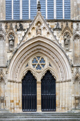 West doors of York Minster set in an archivolt, architecture detail, northern England