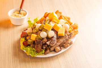 dish with onion, quail egg, pepperoni and cheese, meat
