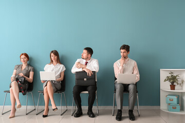 Fototapeta premium Young applicants waiting for job interview in room