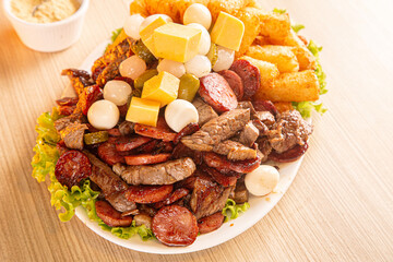 dish with onion, quail egg, pepperoni and cheese, meat
