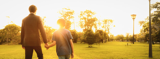 Visionary and eco conscious businessman father guide his son to the bright future with sunset setting using clean alternative energy and sustainable environmental paving way to promising tomorrow.Gyre