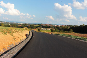 An image of the construction of a new paved road.