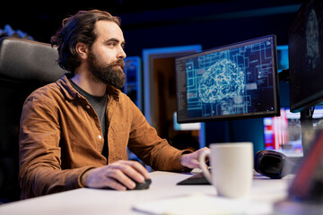 Software developer using computer for artificial intelligence computing simulating human brain...