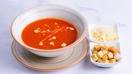 Tomato soup bowl with crackers