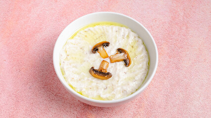 Creamy mushroom soup bowl top view	