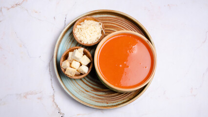 Tomato soup bowl with crackers