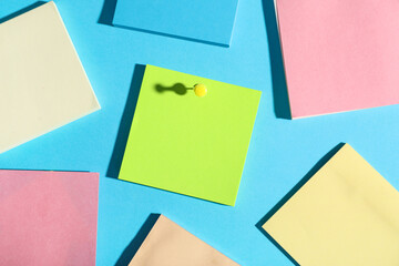 Paper note pinned on blue background