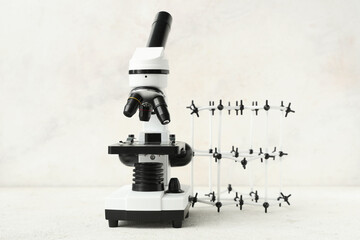 Microscope and molecule on light background