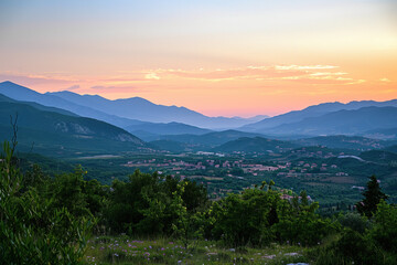 Fototapeta premium A beautiful mountain range with a sunset in the background