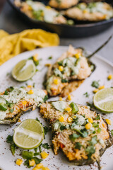 Stuffed poblano peppers with cilantro lime sauce