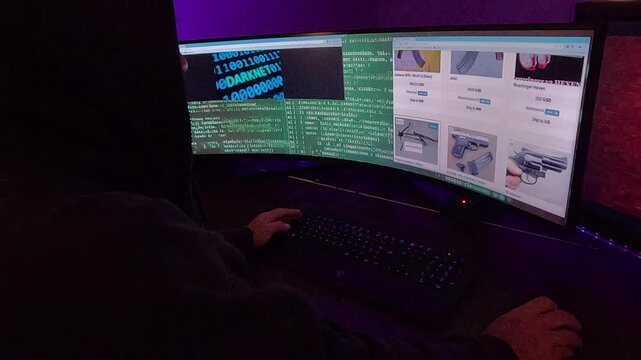 A hooded hacker types on a keyboard, illuminated by the dim light of an ominous screen filled with dark web symbols. Behind him, images suggest illicit activities like arms trading. 