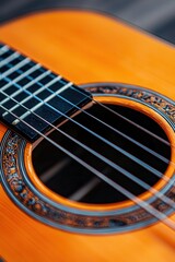 Obraz premium Acoustic Guitar Close Up Strings Soundhole Wood Grain