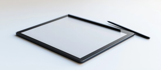 Graphic tablet and stylus resting on a white background
