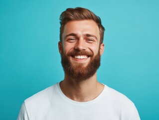 Fototapeta premium Smiling Bearded Man with a Bright Expression on Blue Background. Generative AI.