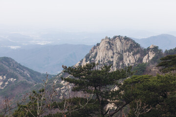 Bukhansan National Park, Seoul, Gyeonggi-do, South Korea, spring landscape view during hike to Baegundae summit peak, process of trekking and climbing to Bukhan mountain, travel and hiking in Korea