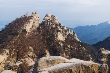 Bukhansan National Park, Seoul, Gyeonggi-do, South Korea, spring landscape view during hike to Baegundae summit peak, process of trekking and climbing to Bukhan mountain, travel and hiking in Korea