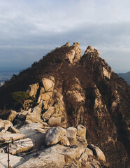 Bukhansan National Park, Seoul, Gyeonggi-do, South Korea, spring landscape view during hike to Baegundae summit peak, process of trekking and climbing to Bukhan mountain, travel and hiking in Korea