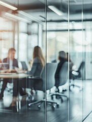 Business meeting behind glass wall partition, with focus on transparent divider surface – corporate teamwork, office privacy, modern workspace design