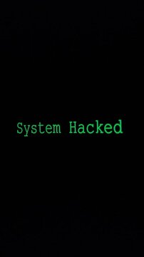 Zoom System Hacked Screen, displaying green text on a black background, resembling a classic hacking alert with a digital font, conveying a sense of intrusion.