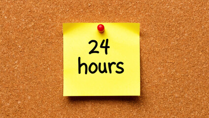 24 hours word written on a note sticky on corkboard