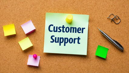 customer support word written on a note sticky on corkboard