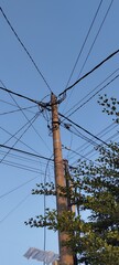 tangled power electric lines on a sky