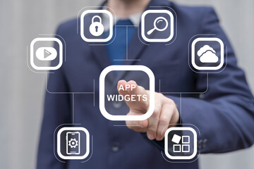 Man working on virtual touch screen presses inscription: APP WIDGETS. App widget web mobile computer technology concept. Widgets apps.