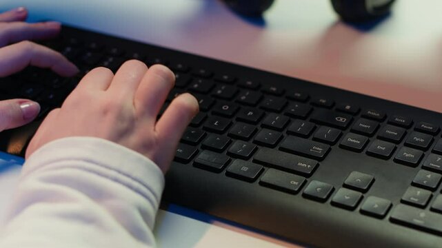 Computer technician working from home, designing and developing software applications, close up. IT specialist typing on PC keyboard, implementing and maintaining company systems, camera A