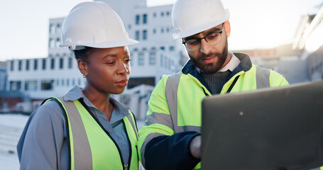 Team, tech or planning construction on rooftop for building maintenance, civil engineer or discussion. Contractors, laptop or project management in city with architect for infrastructure development