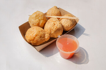Fried Meatball dish and sauce on white background
