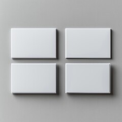 Fototapeta premium Four Blank White Cards Mockup on a Gray Wall