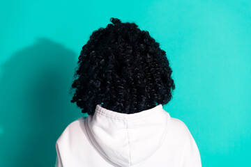 Rear view photo of young brunette chevelure hairstyle lady wearing white hoodie isolated on aquamarine color background