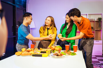 A group of Asian friends gathers in an office for a night of BBQ, pizza, and drinks, celebrating Halloween with vibrant RGB lighting, laughter, and cheering for their favorite soccer team.