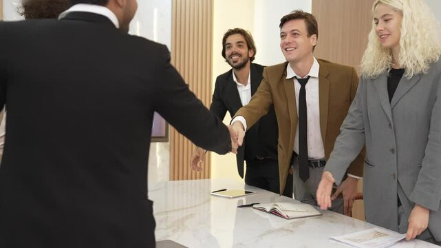 Diverse office worker employee greeting and introducing before strategic business marketing planning in ornamented office. Business partnership or financial consultant advisor introducing themself