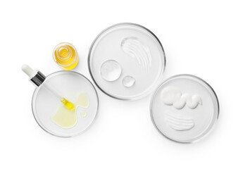 Petri dishes with different cosmetic products isolated on white, top view