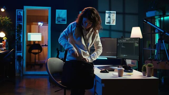 Developer holding disposable cup of coffee entering office to implement security measures, protecting company systems and data. IT worker starting job shift, testing and debugging code, camera B